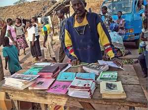 Man selling literacy books in the market