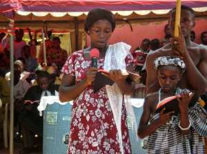 Woman and child reading the Bible in their language